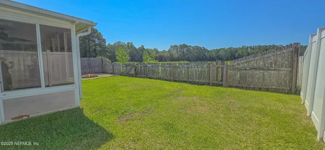 a view of a backyard with a small cabin