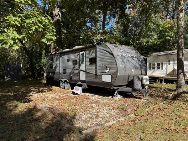 a view of a house with a yard covered in snow