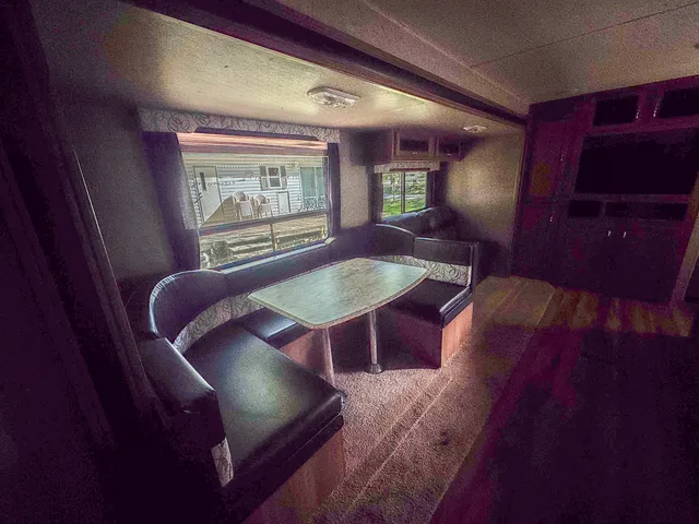 a white toilet sitting next to a sink