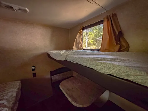 a room with rug equipment and windows