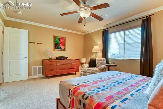 a bedroom with 2 bed and a window