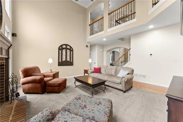a kitchen with stainless steel appliances white cabinets and a sink