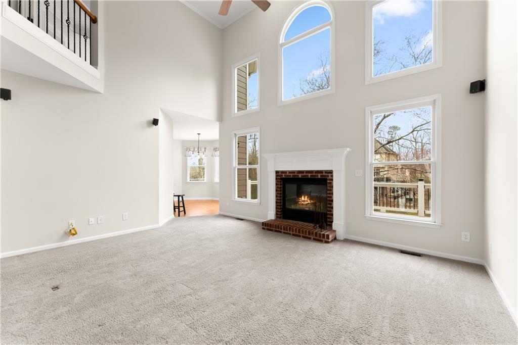 1070 Coleridge Way Suwanee, GA 30024 - Photo 12 of 76 a view of empty room with a fireplace