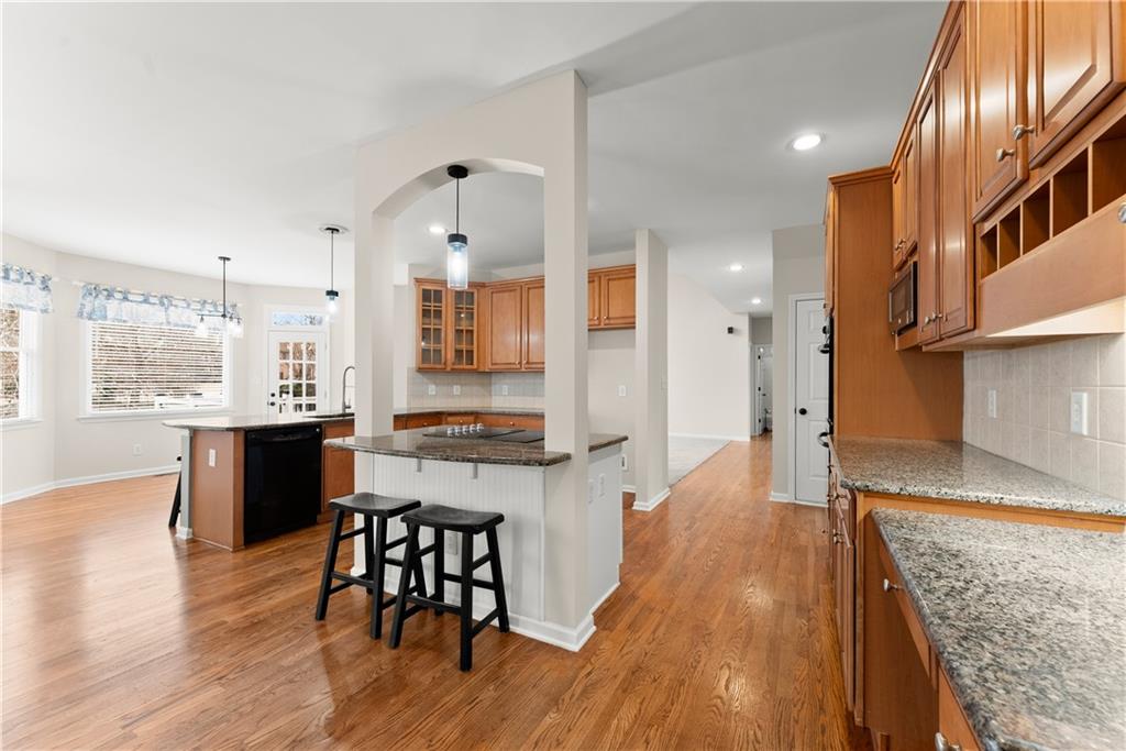 1070 Coleridge Way Suwanee, GA 30024 - Photo 17 of 76 a large kitchen with a table and chairs in it