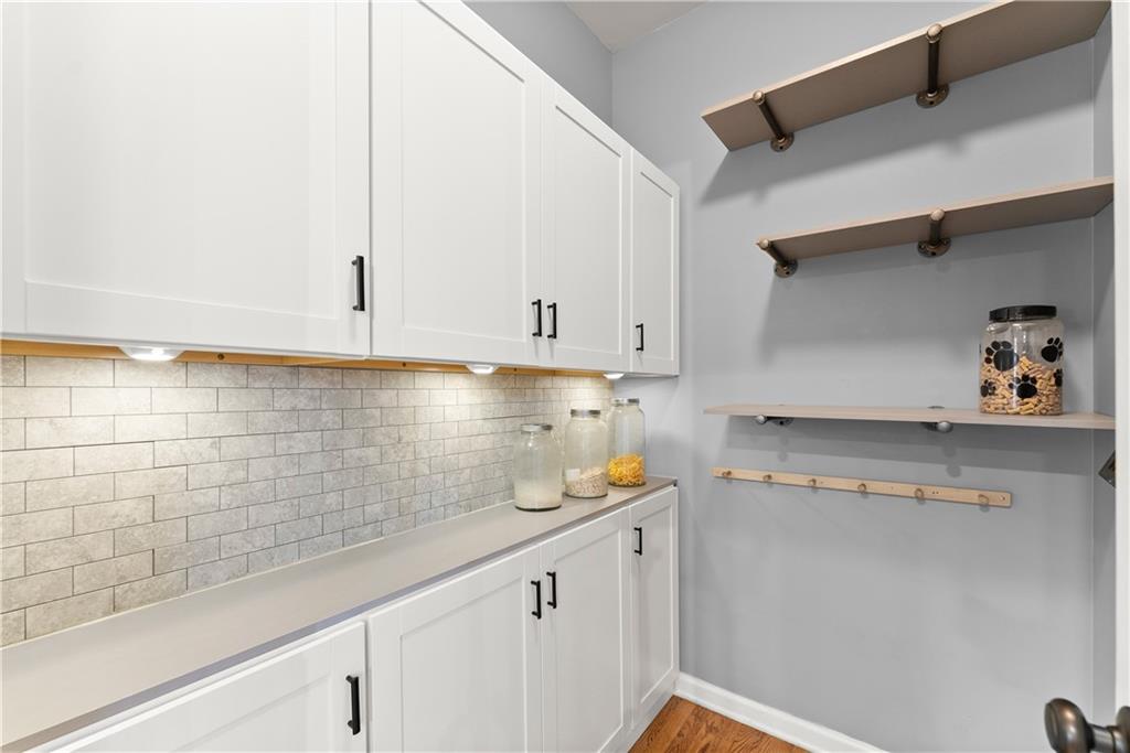 1070 Coleridge Way Suwanee, GA 30024 - Photo 20 of 98 a kitchen with stainless steel appliances white cabinets and a sink