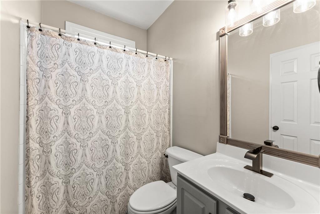1070 Coleridge Way Suwanee, GA 30024 - Photo 24 of 76 a bathroom with a sink toilet and shower