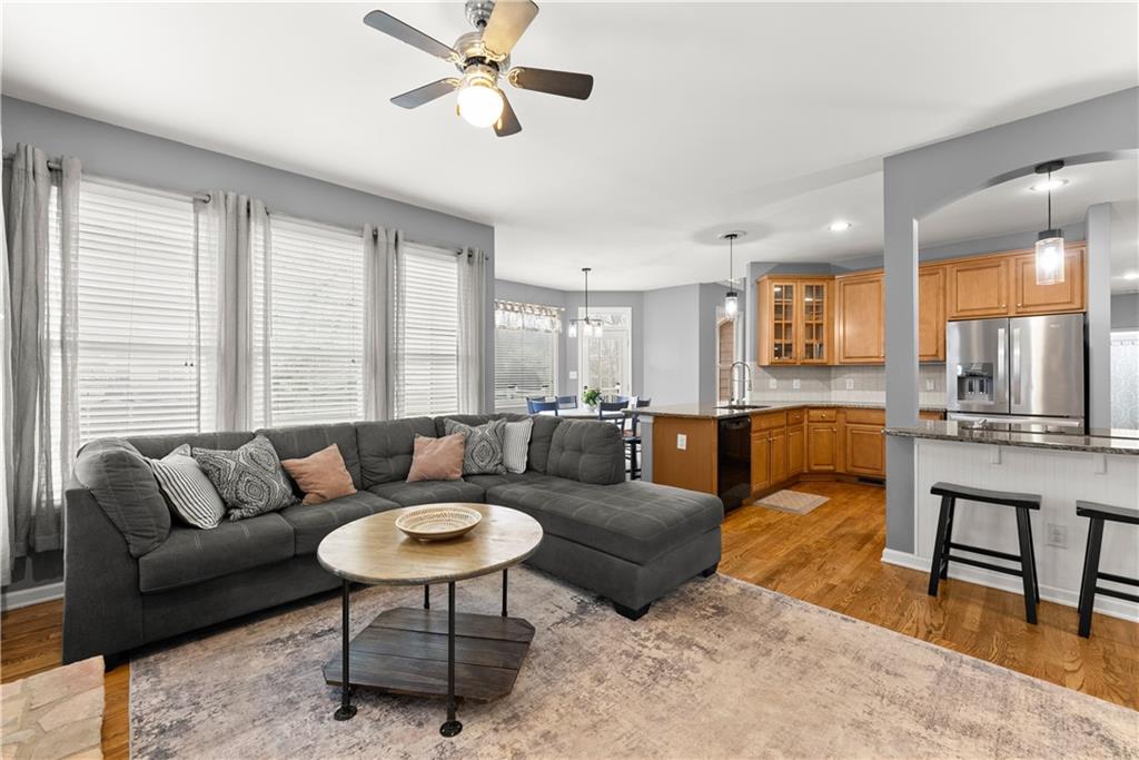 1070 Coleridge Way Suwanee, GA 30024 - Photo 24 of 98 a living room with furniture and a view of kitchen
