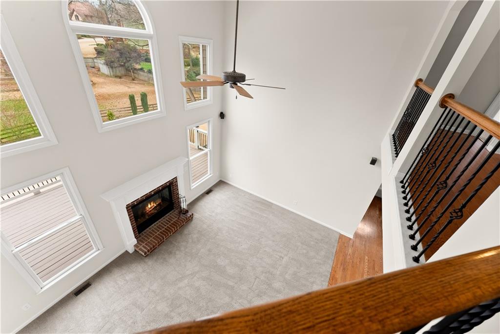 1070 Coleridge Way Suwanee, GA 30024 - Photo 25 of 76 a view of a livingroom with wooden floor and staircase