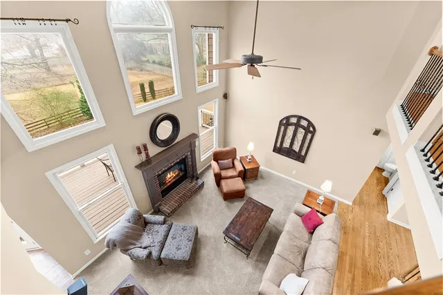 a spacious bathroom with a tub sink and mirror