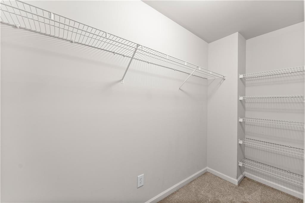 1070 Coleridge Way Suwanee, GA 30024 - Photo 40 of 76 a view of a room with racks on the wall