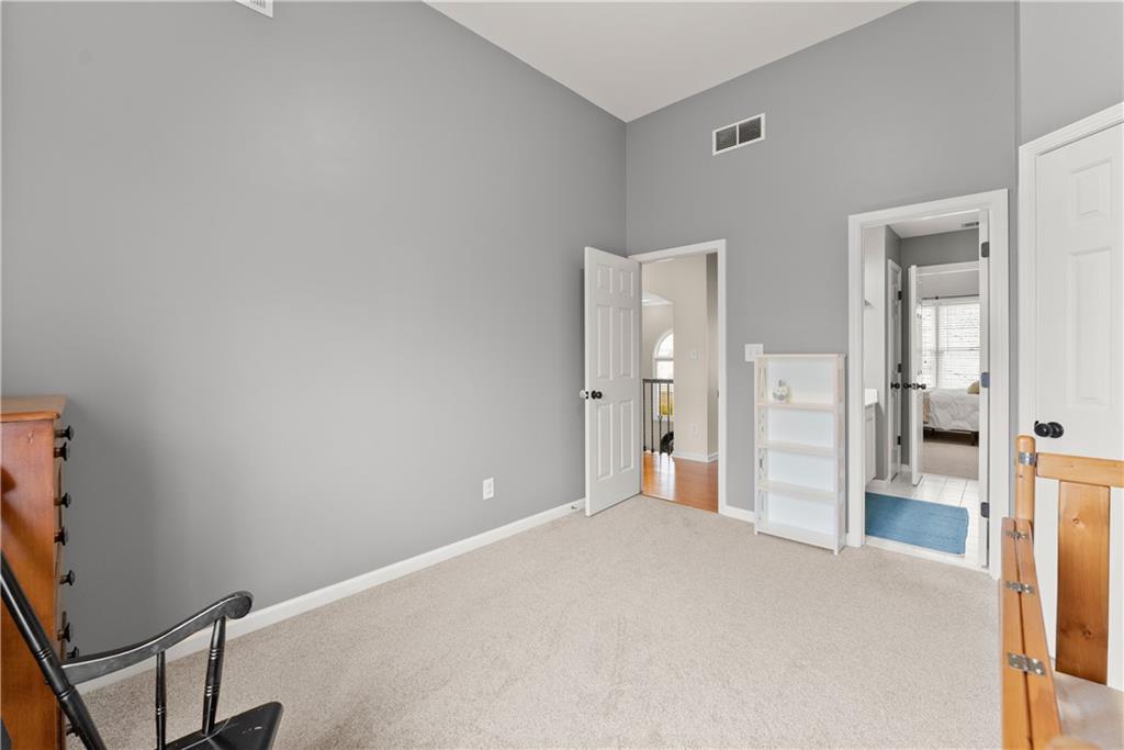 1070 Coleridge Way Suwanee, GA 30024 - Photo 48 of 98 a view of a room with wooden floor and bathroom