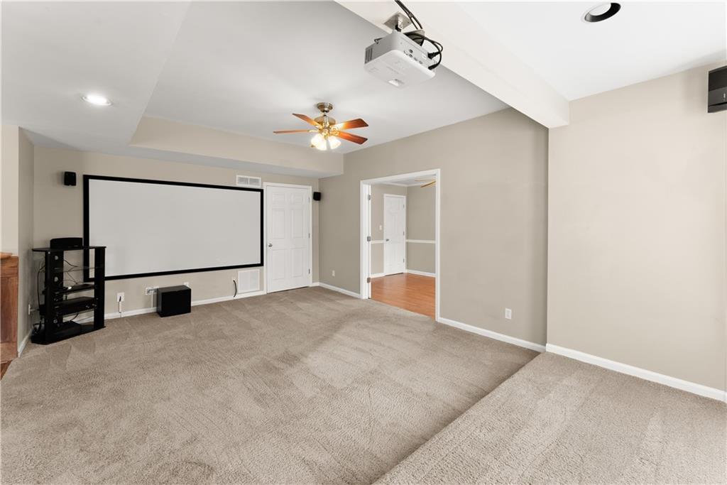 1070 Coleridge Way Suwanee, GA 30024 - Photo 57 of 76 a view of a livingroom with a flat screen tv
