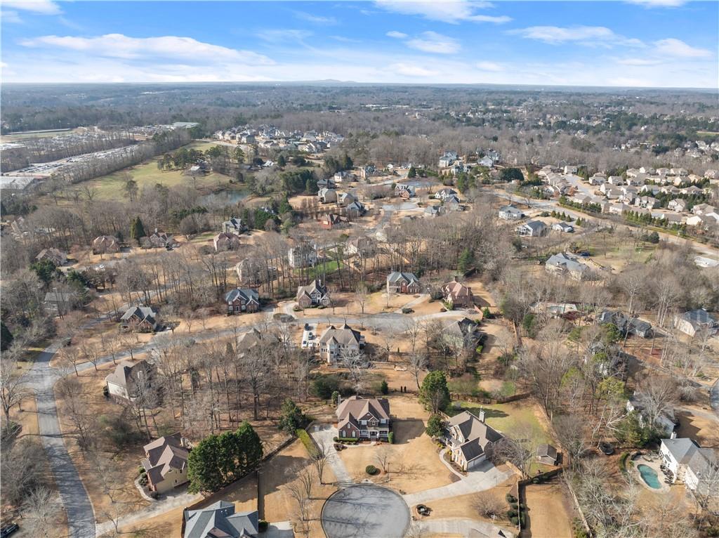 1070 Coleridge Way Suwanee, GA 30024 - Photo 90 of 98 an aerial view of residential building with parking space