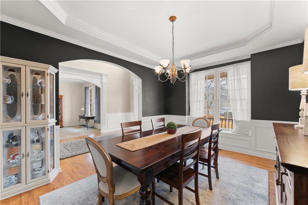 1070 Coleridge Way Suwanee, GA 30024 - Photo 9 of 98 a view of a dining room with furniture window and wooden floor