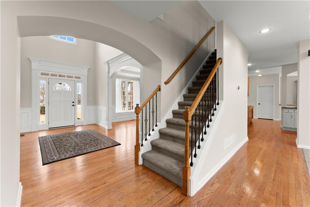 1070 Coleridge Way Suwanee, GA 30024 - Photo 9 of 76 a view of entryway and hall with wooden floor