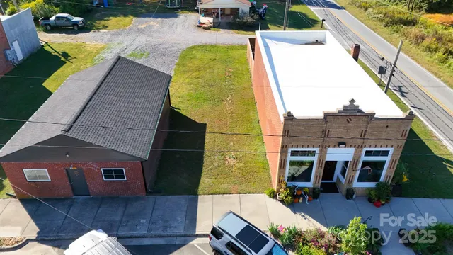 an aerial view of a house with a swimming pool