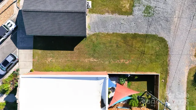 an aerial view of a house with a garden