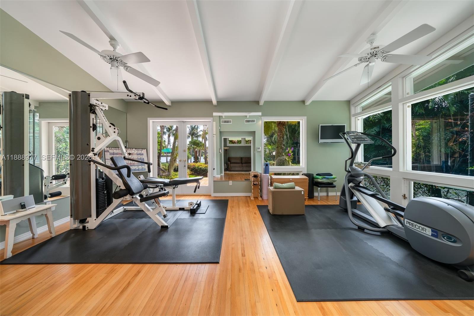 8845 School House Road Coral Gables, FL 33156 - Photo 14 of 23 a view of a room with gym equipment