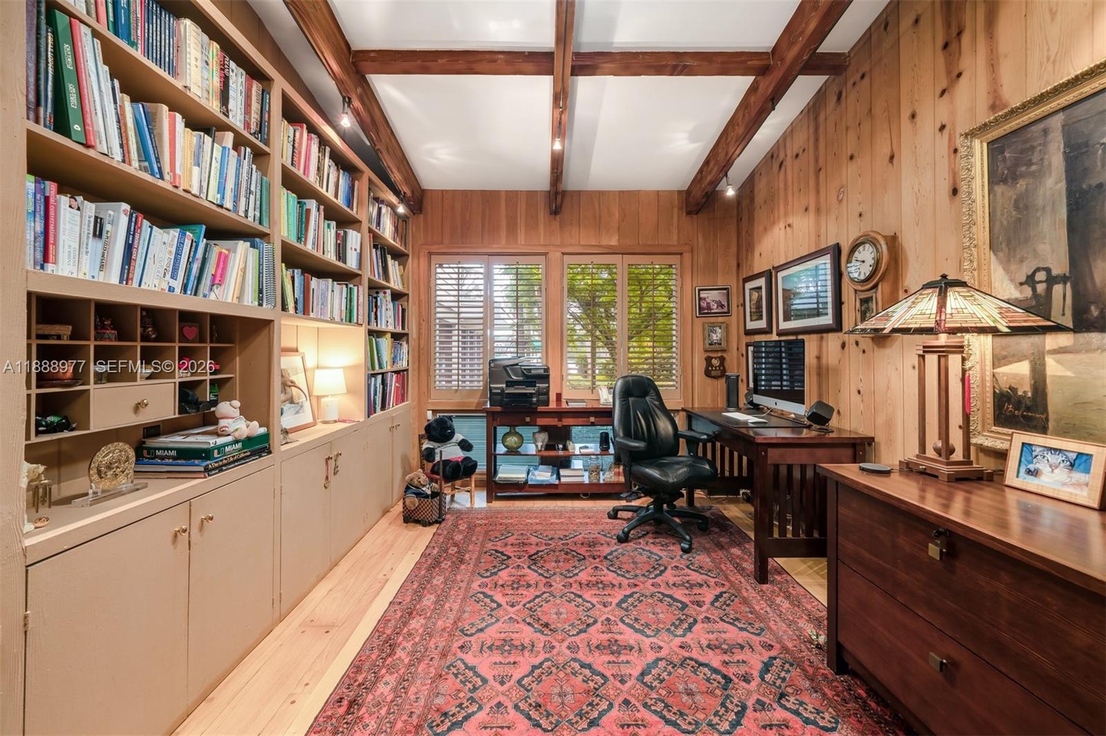 8845 School House Road Coral Gables, FL 33156 - Photo 16 of 23 a very nice looking room with a large window and a fireplace