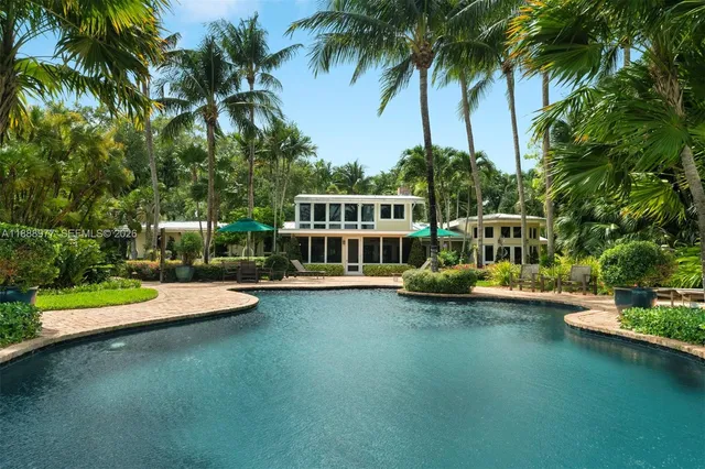 a view of a swimming pool with a table and chairs