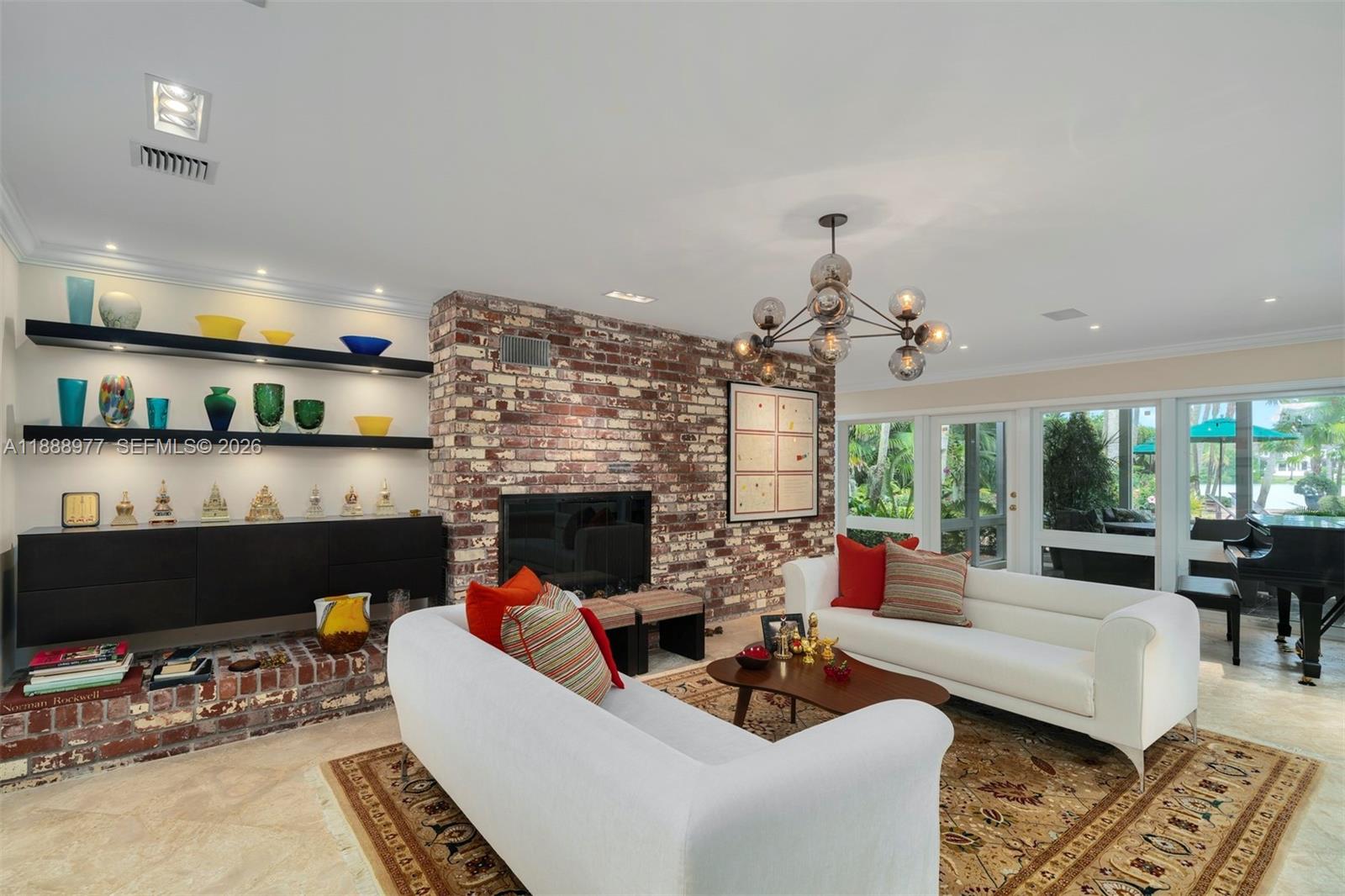 8845 School House Road Coral Gables, FL 33156 - Photo 6 of 23 a living room with furniture and a fireplace
