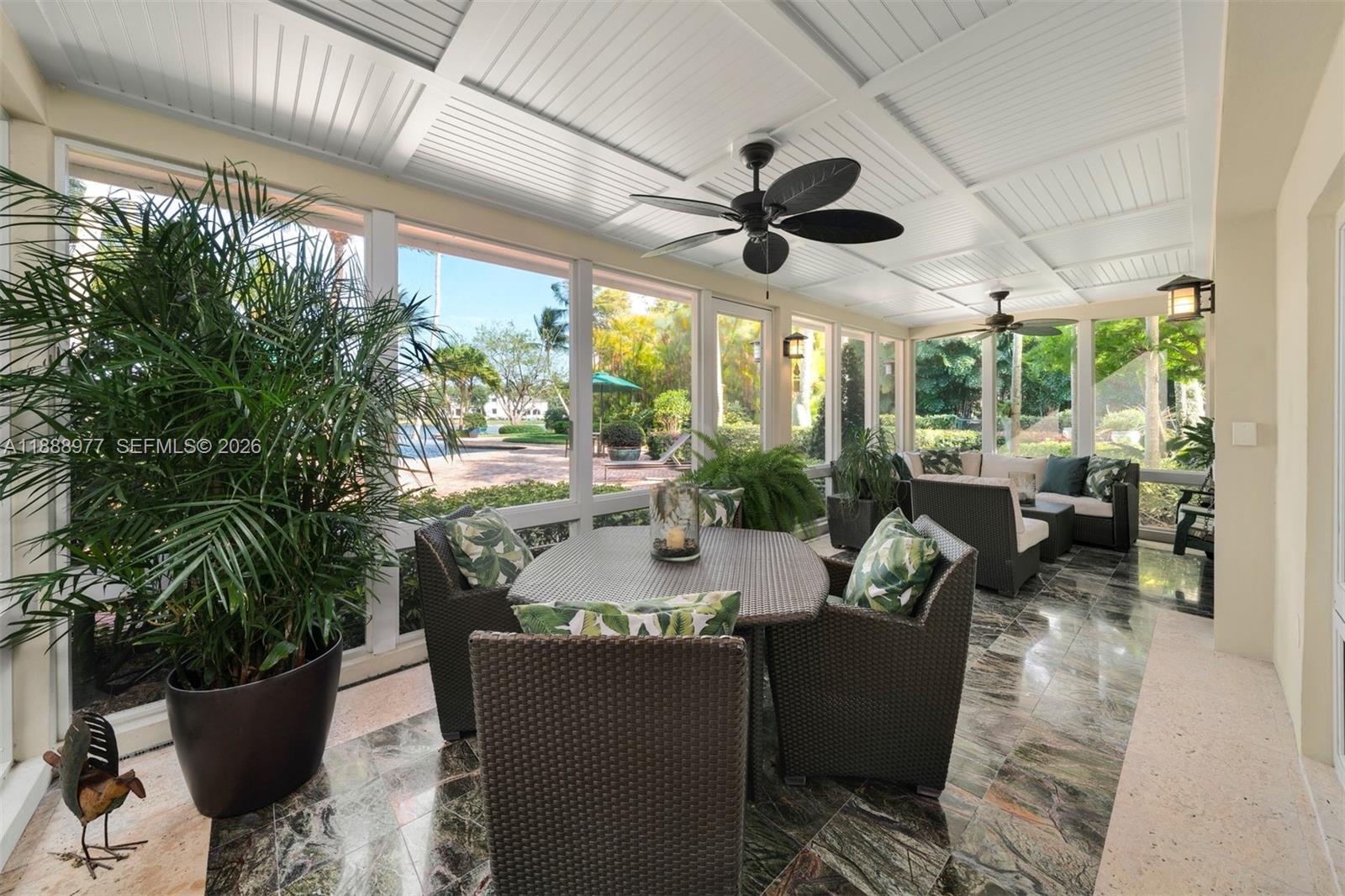 8845 School House Road Coral Gables, FL 33156 - Photo 7 of 23 a view of a dining room with furniture window and outside view