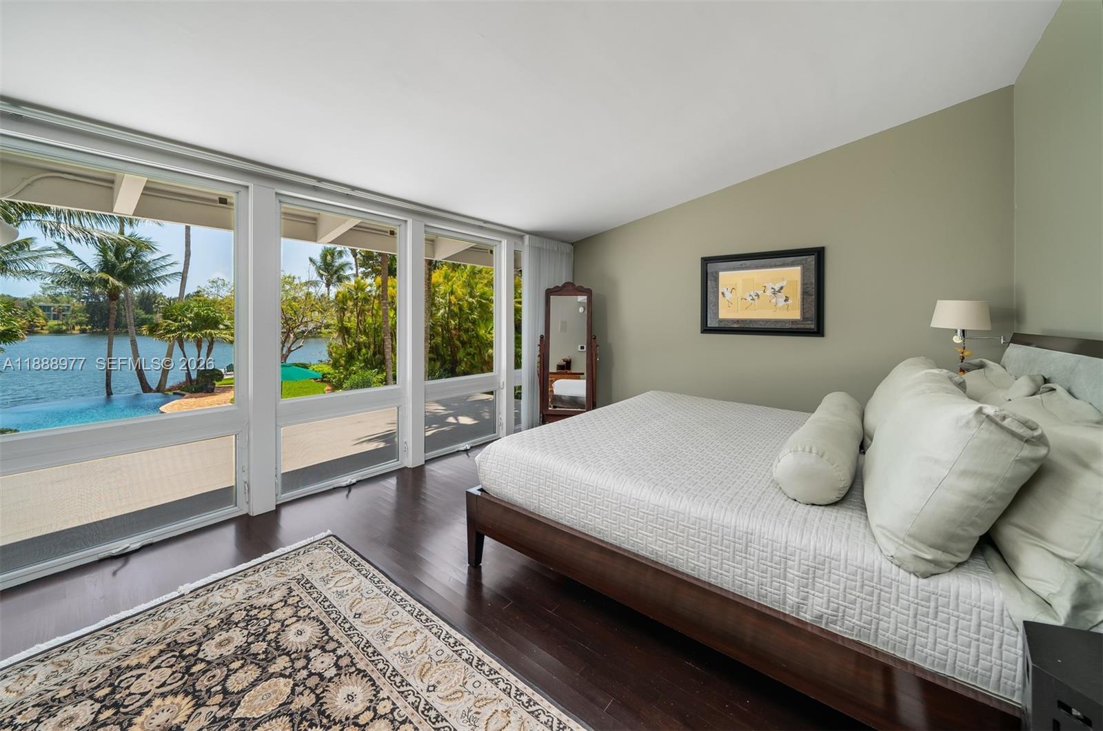 8845 School House Road Coral Gables, FL 33156 - Photo 10 of 23 a bedroom with a bed and glass door