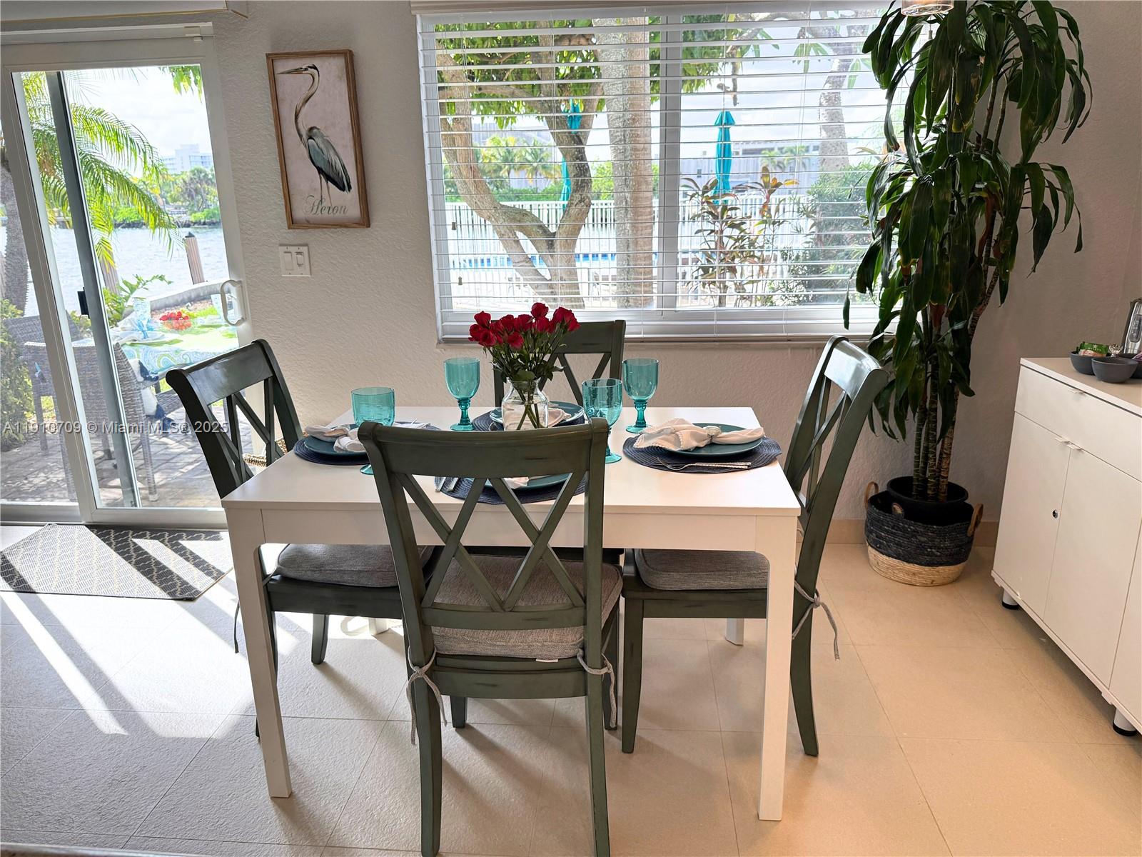a dining room with furniture and window