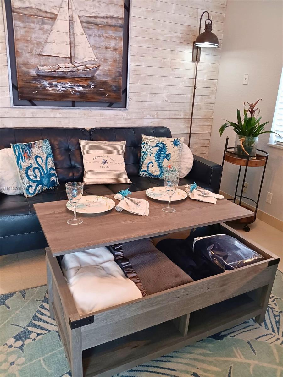 1705 North Riverside Drive, Unit 1 Pompano Beach, FL 33062 - Photo 16 of 36 a view of table and chairs in living room