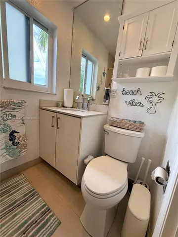 a bathroom with a shower and a sink