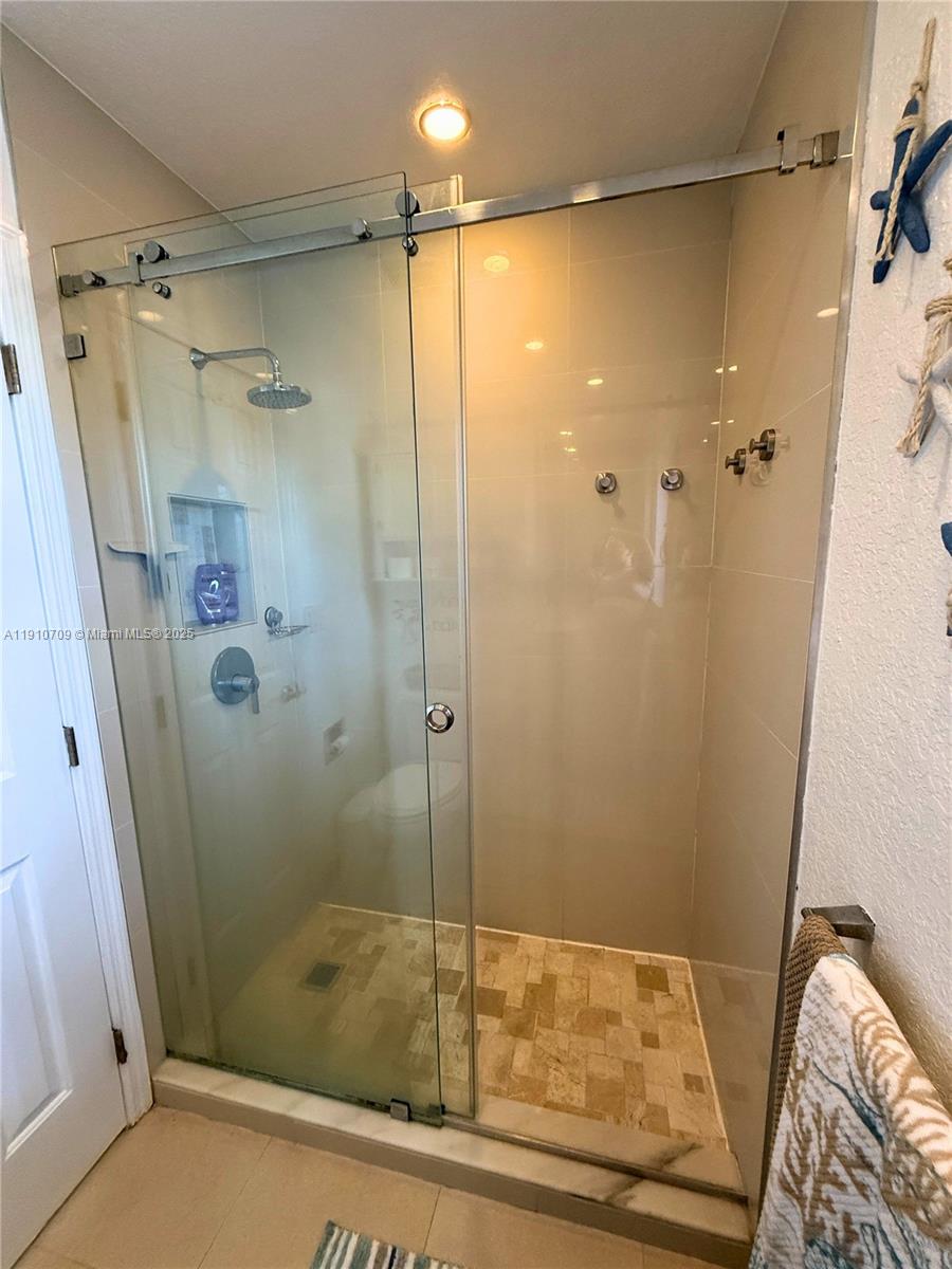 1705 North Riverside Drive, Unit 1 Pompano Beach, FL 33062 - Photo 18 of 36 a bathroom with a shower and a sink