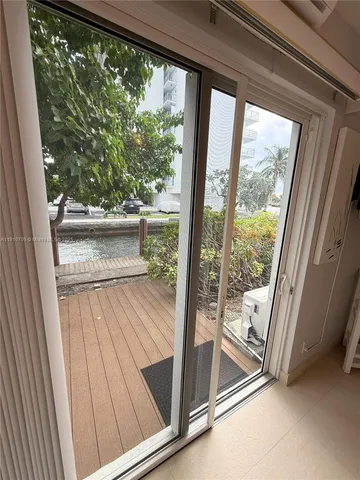 a en suite bathroom with a glass shower door and a bathtub