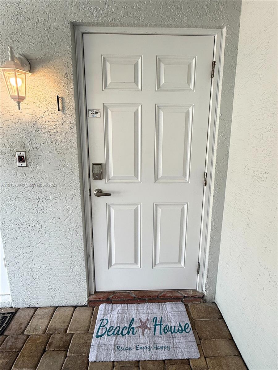 1705 North Riverside Drive, Unit 1 Pompano Beach, FL 33062 - Photo 28 of 36 an entryway with a window