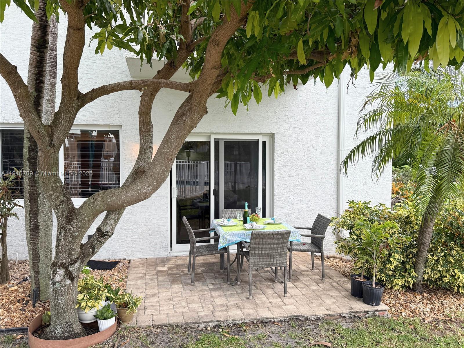 1705 North Riverside Drive, Unit 1 Pompano Beach, FL 33062 - Photo 4 of 36 a view of a house with backyard and sitting area