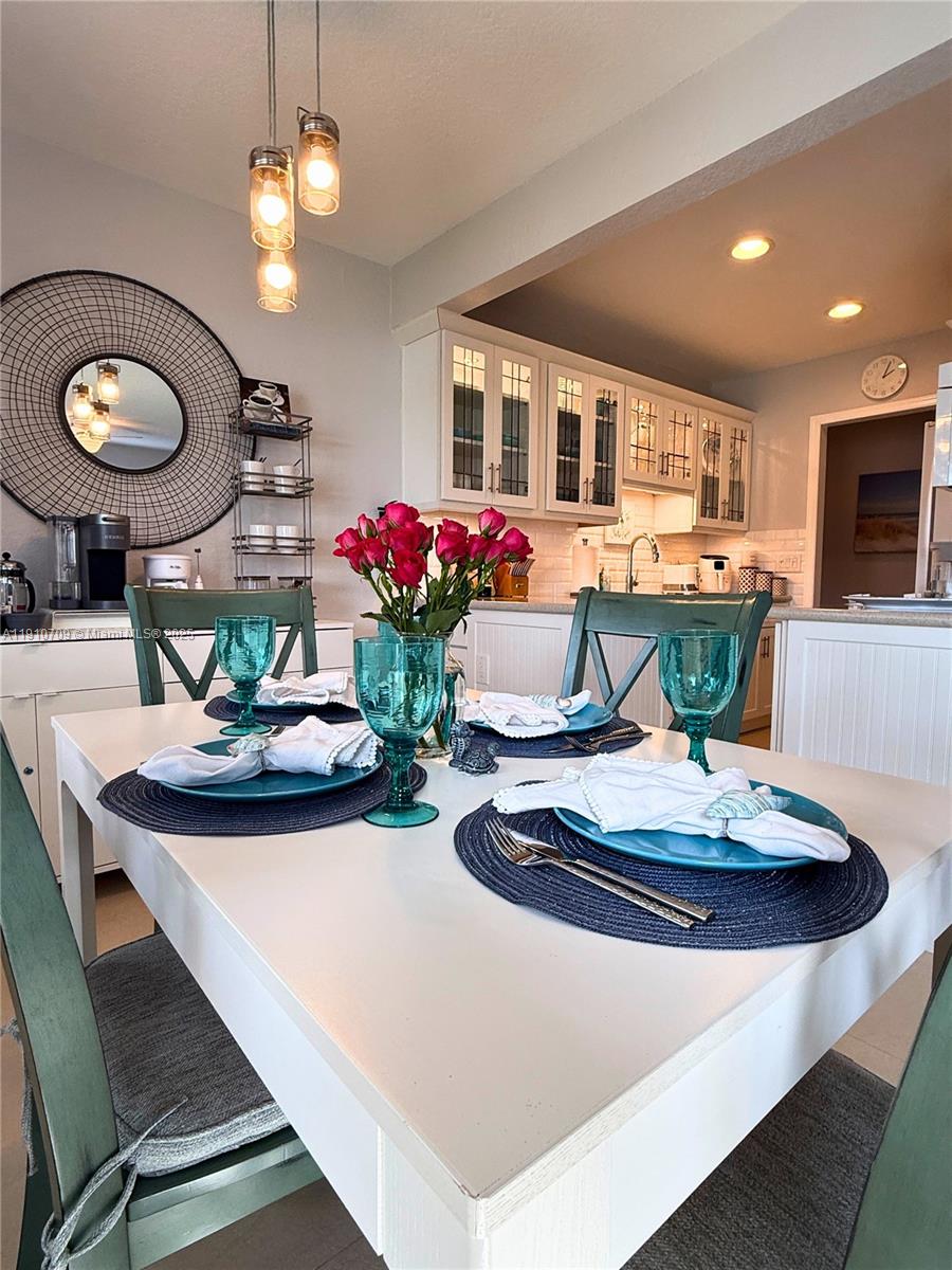 1705 North Riverside Drive, Unit 1 Pompano Beach, FL 33062 - Photo 9 of 36 a view of a dining room with furniture