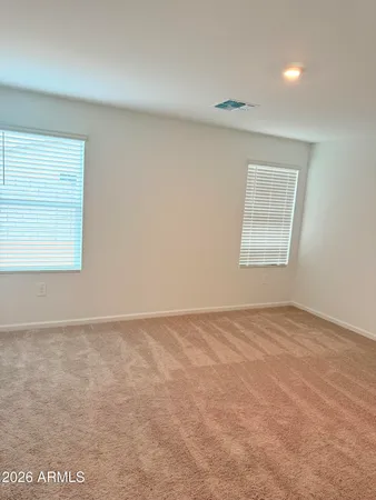 a view of kitchen with stainless steel appliances refrigerator sink and cabinets