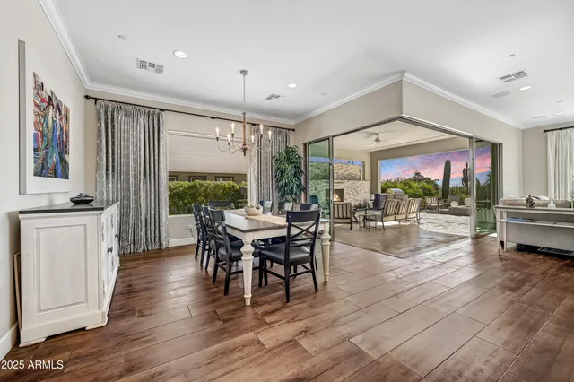 a large kitchen with a table and chairs
