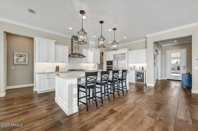 a living room with furniture large window and a flat screen tv