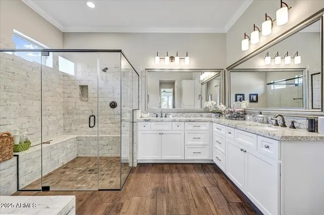 a large white kitchen with cabinets and stainless steel appliances