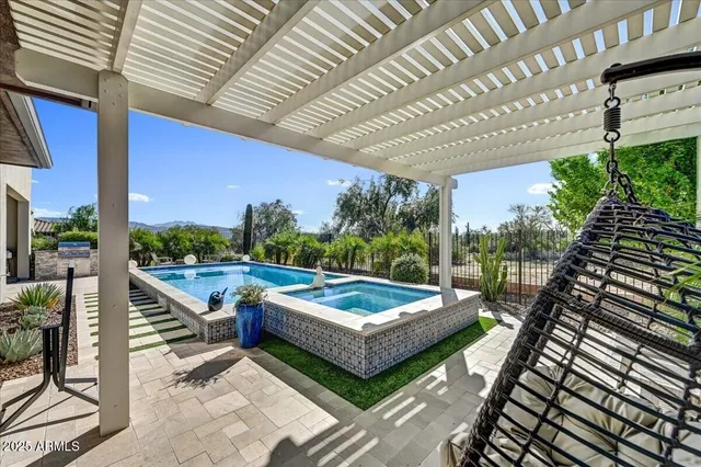a view of a swimming pool with a lake view