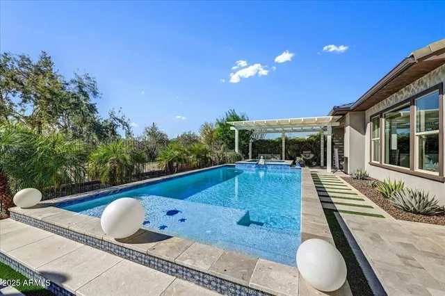 a living room with lots of furniture and garden view