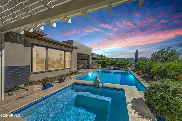 a living room with furniture and a kitchen view