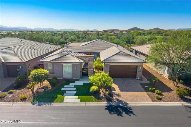 a view of a swimming pool with a slide and potted plants