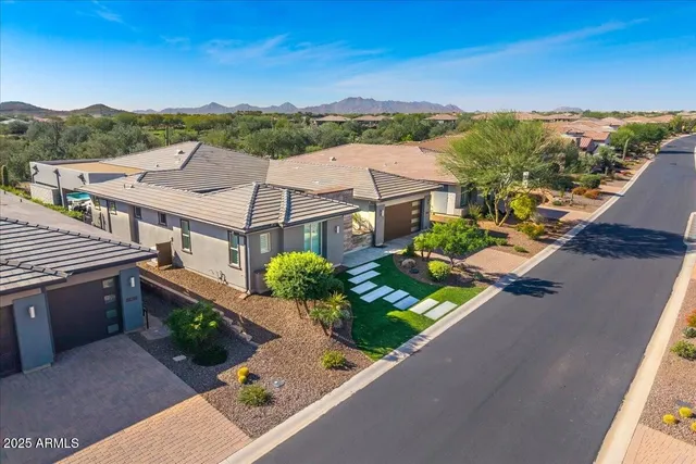 a view of a swimming pool with an outdoor seating and a yard