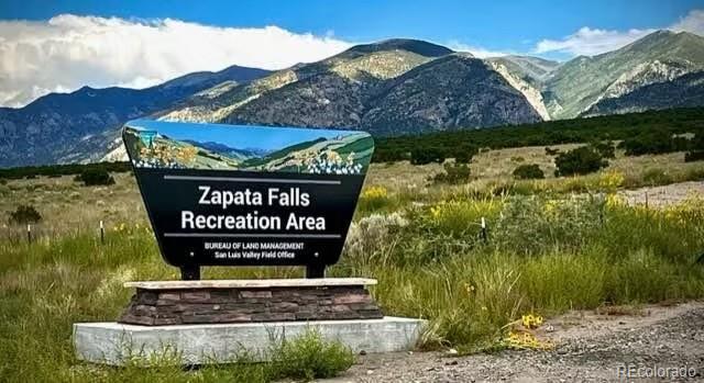 103 Arrowhead Lane Mosca, CO 81146 - Photo 10 of 11 a sign on the side of a road