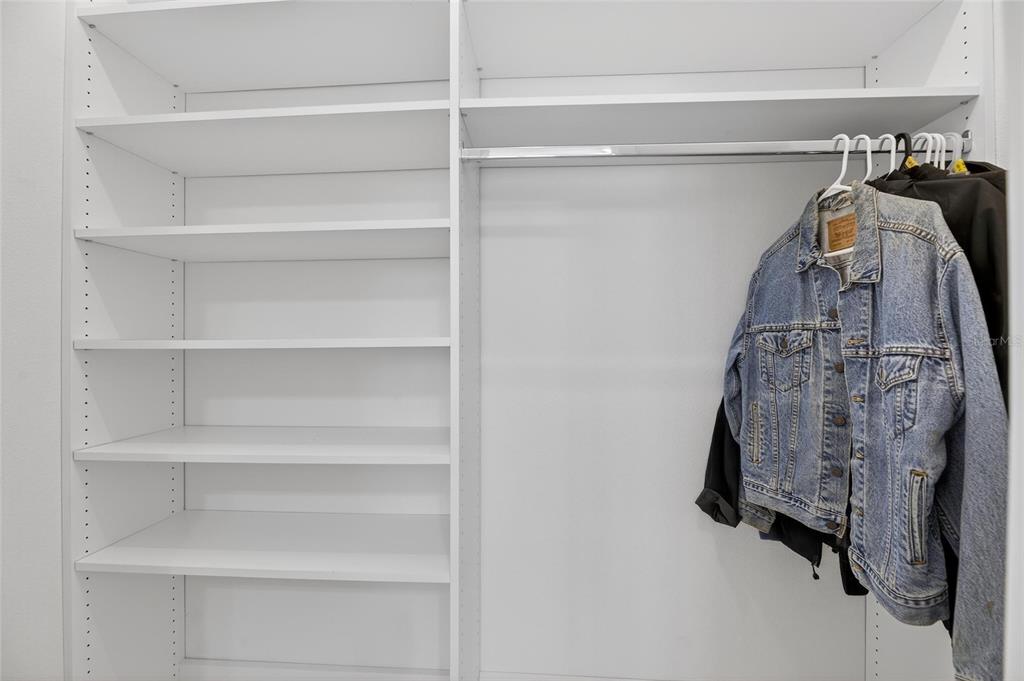994 Signet Drive Apollo Beach, FL 33572 - Photo 45 of 98 a view of walk in closet with clothes and shoes