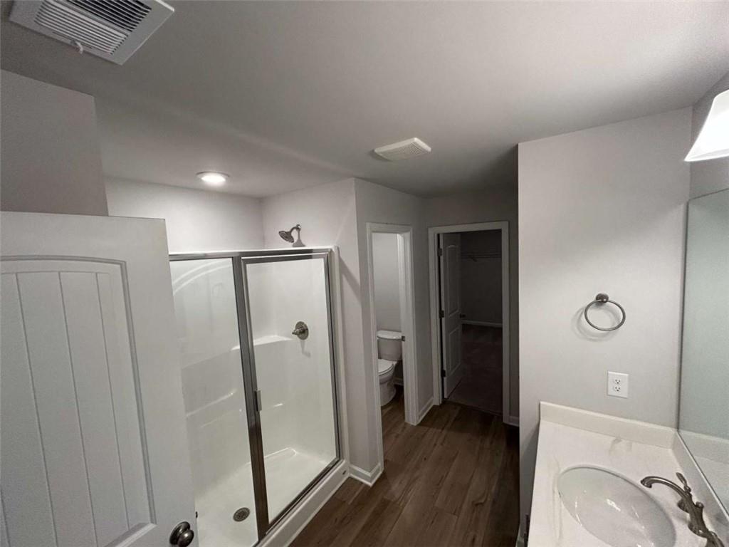 37 Mountain Chase Road Southwest Rome, GA 30165 - Photo 19 of 24 a bathroom with a granite countertop sink a mirror and shower