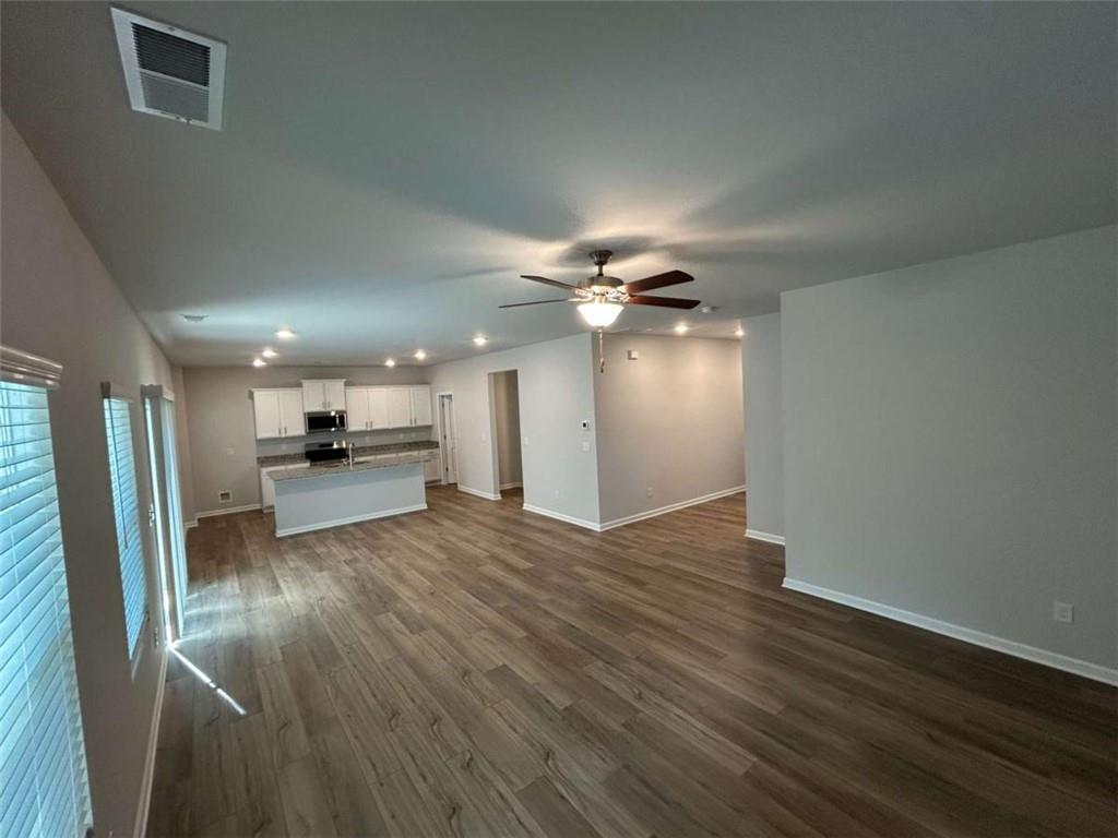 37 Mountain Chase Road Southwest Rome, GA 30165 - Photo 7 of 24 a view of kitchen with refrigerator cabinet and wooden floor