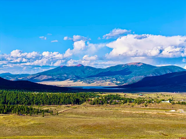 a view of a swimming pool with sunset view
