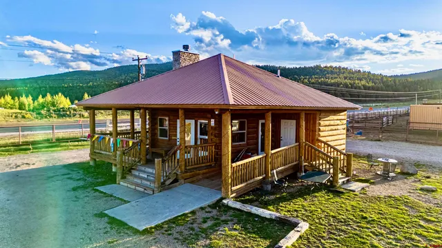 a view of a patio with dining table and chairs with wooden floor